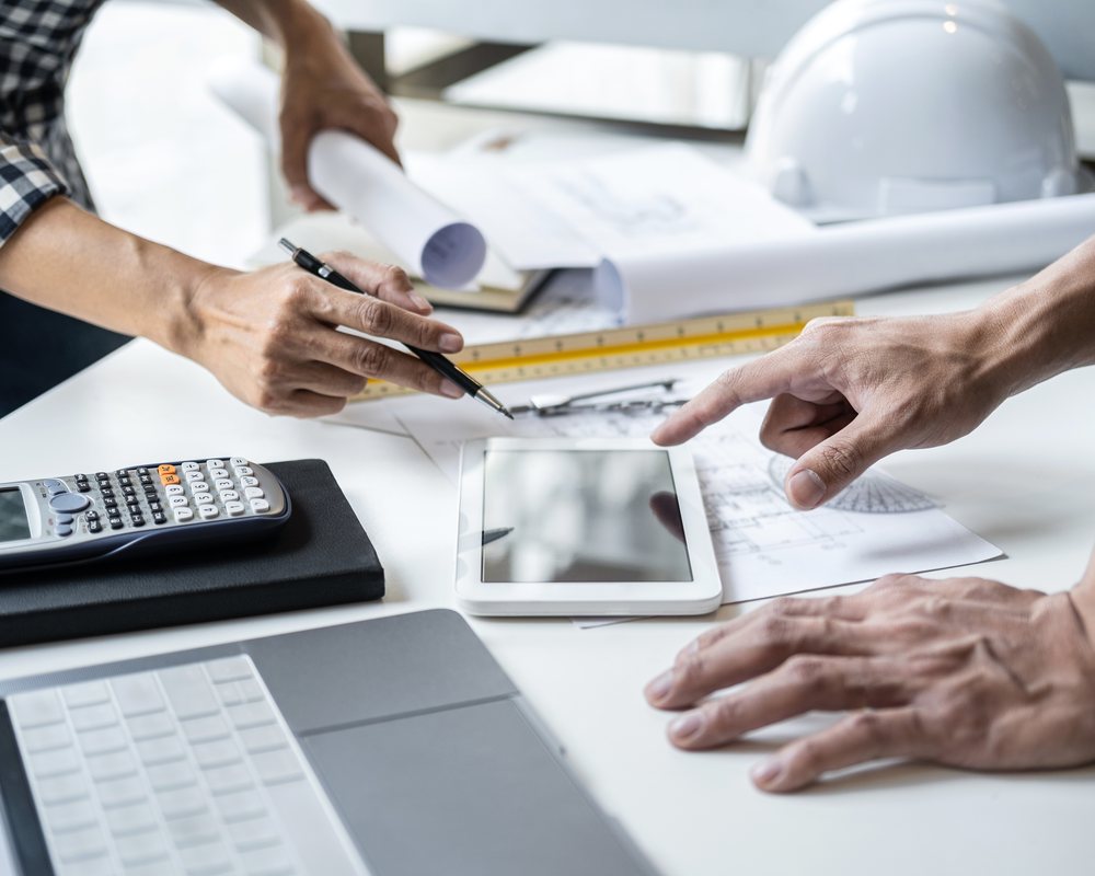 Civil engineers reviewing city infrastructure planning and structural BIM model