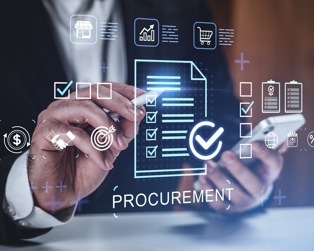 Procurement and vendor-management analyst at workstation reviewing supplier scorecards